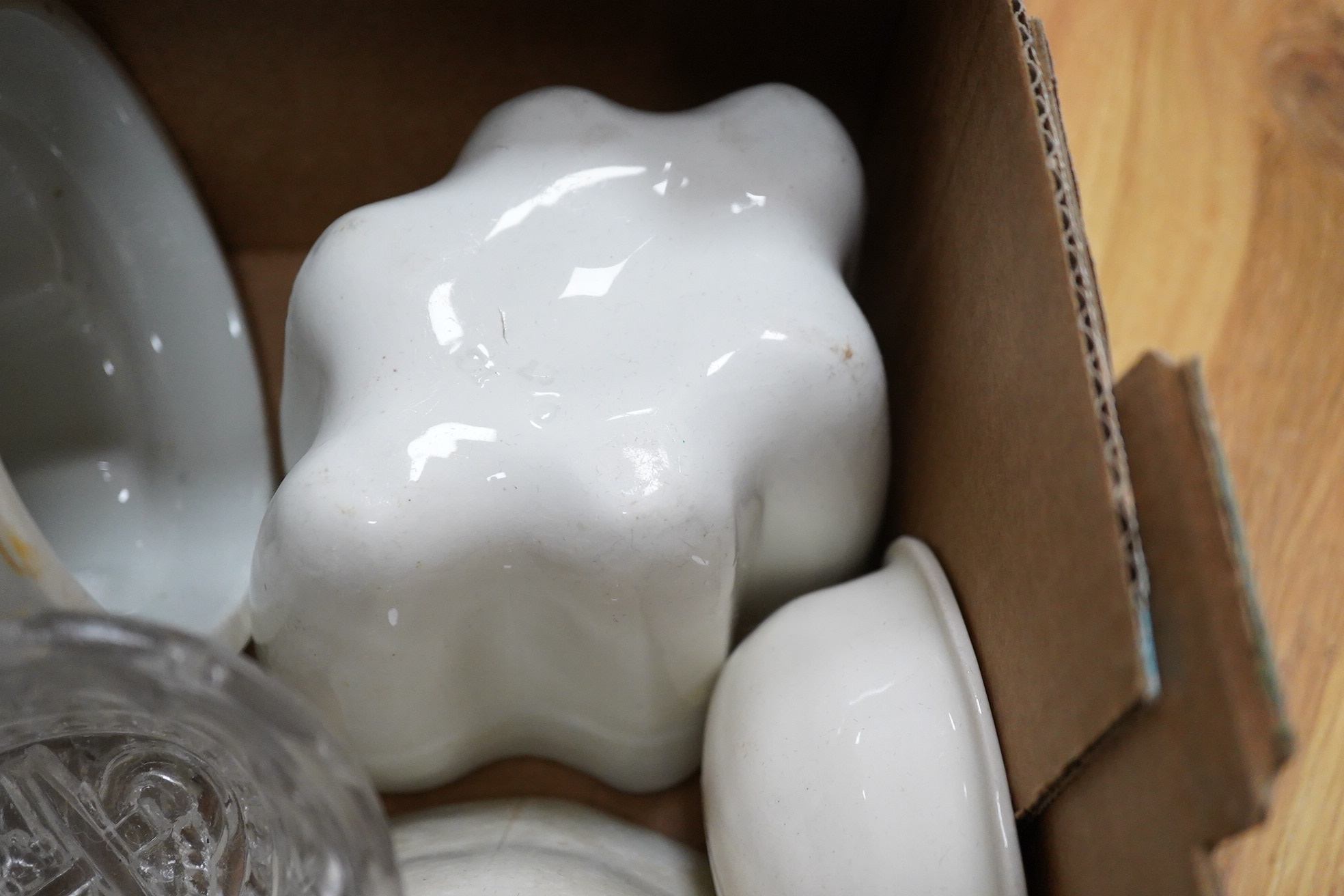 A collection of mostly Victorian ceramic and later glass and metal jelly moulds